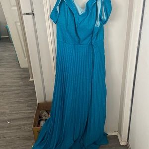 A blue sparkly prom Dress it was woren once.  But it’s to big for me. Its a 3x.
